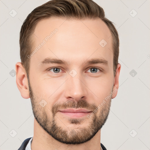 Joyful white young-adult male with short  brown hair and grey eyes