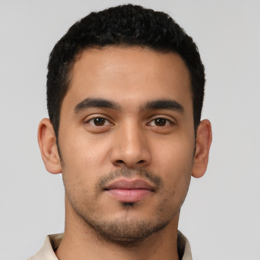Neutral latino young-adult male with short  black hair and brown eyes