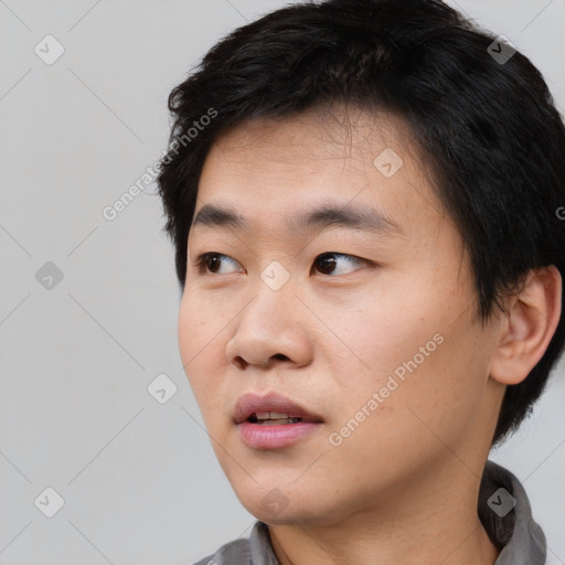 Neutral asian young-adult male with short  black hair and brown eyes