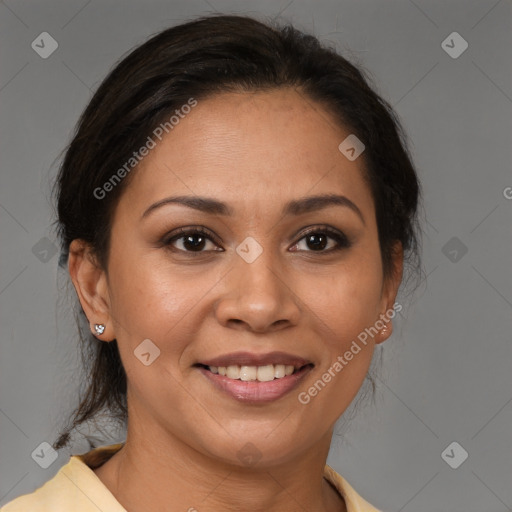 Joyful latino adult female with medium  brown hair and brown eyes