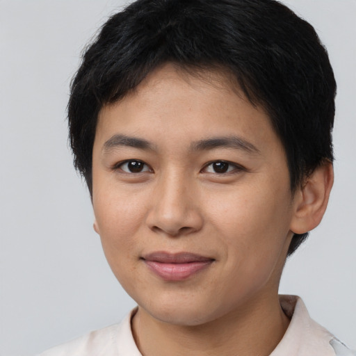 Joyful asian young-adult female with short  brown hair and brown eyes