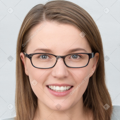 Joyful white young-adult female with long  brown hair and blue eyes