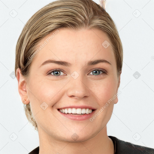 Joyful white young-adult female with medium  brown hair and grey eyes