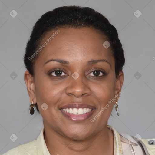 Joyful black young-adult female with short  brown hair and brown eyes