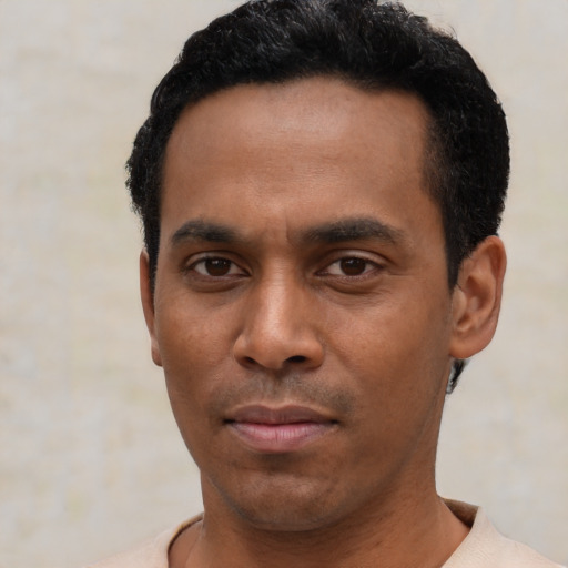 Neutral latino young-adult male with short  black hair and brown eyes