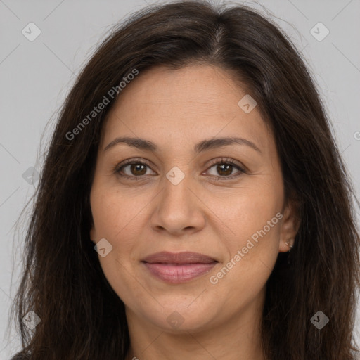 Joyful white adult female with long  brown hair and brown eyes