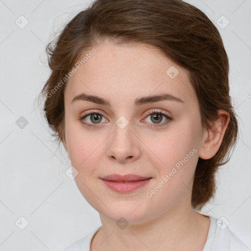 Joyful white young-adult female with medium  brown hair and green eyes