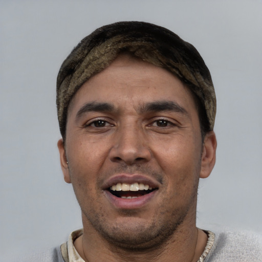 Joyful white young-adult male with short  black hair and brown eyes