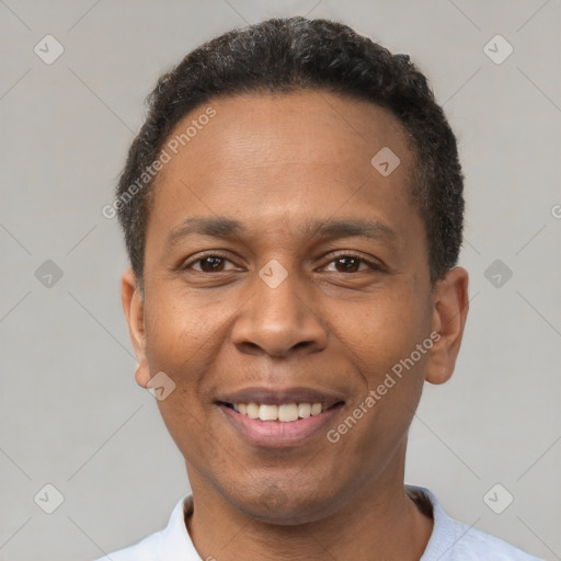 Joyful latino adult male with short  black hair and brown eyes