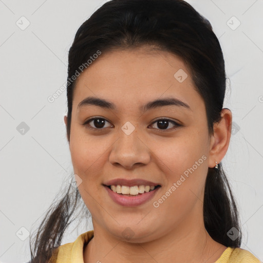 Joyful latino young-adult female with medium  brown hair and brown eyes