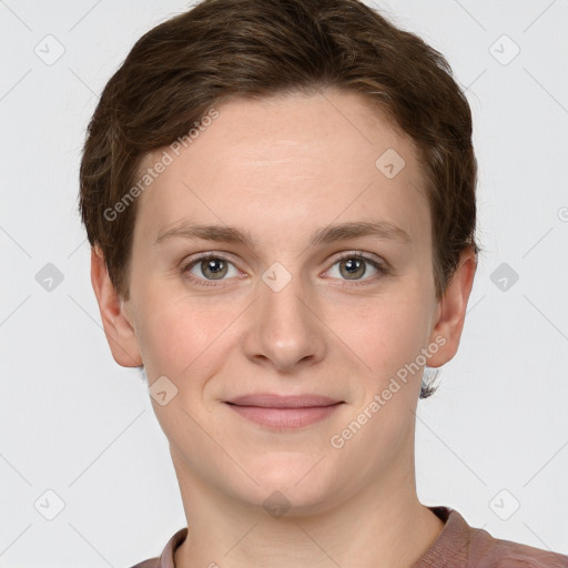 Joyful white young-adult female with short  brown hair and grey eyes