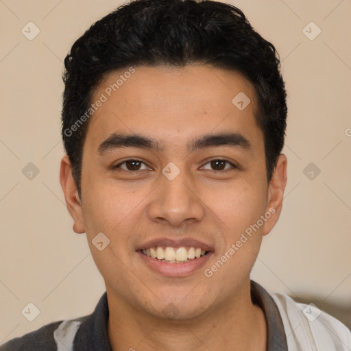 Joyful latino young-adult male with short  black hair and brown eyes