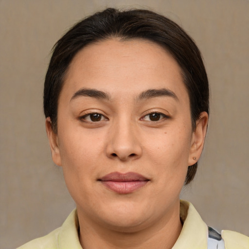 Joyful asian young-adult female with medium  brown hair and brown eyes