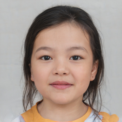 Joyful white child female with medium  brown hair and brown eyes