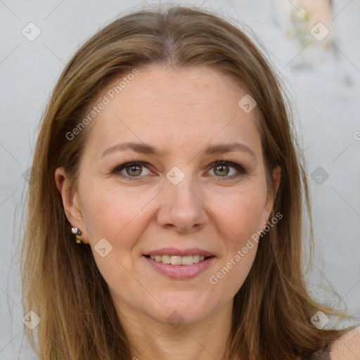 Joyful white adult female with long  brown hair and grey eyes