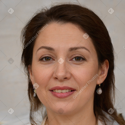 Joyful white adult female with medium  brown hair and brown eyes