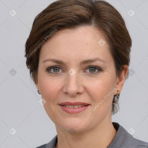 Joyful white adult female with short  brown hair and grey eyes