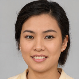 Joyful white young-adult female with medium  brown hair and brown eyes