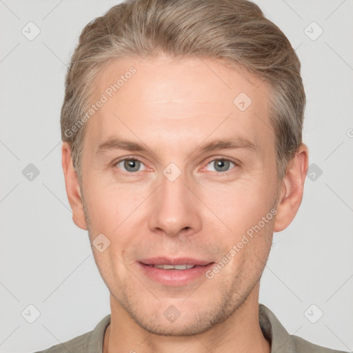 Joyful white adult male with short  brown hair and grey eyes