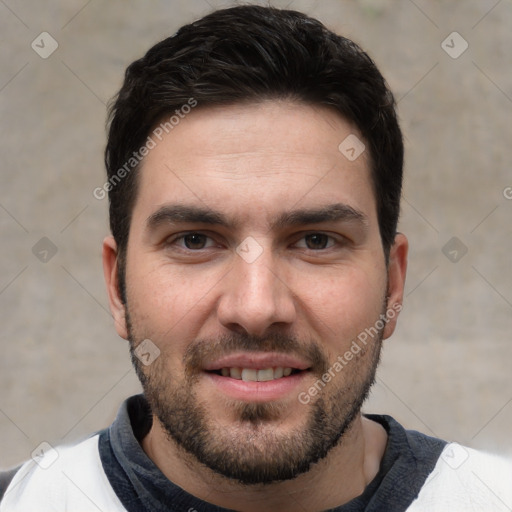 Joyful white young-adult male with short  black hair and brown eyes