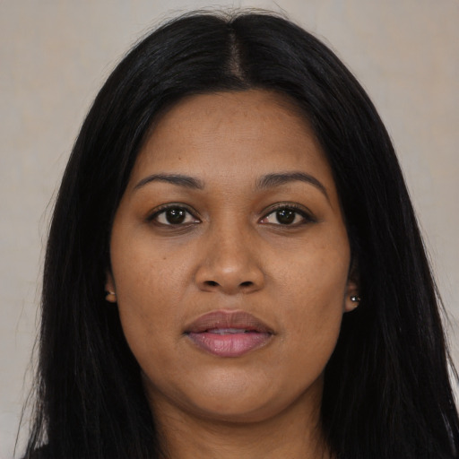 Joyful asian young-adult female with long  black hair and brown eyes