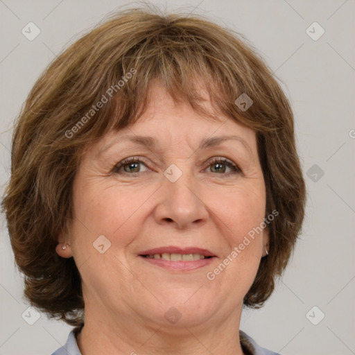 Joyful white middle-aged female with medium  brown hair and grey eyes