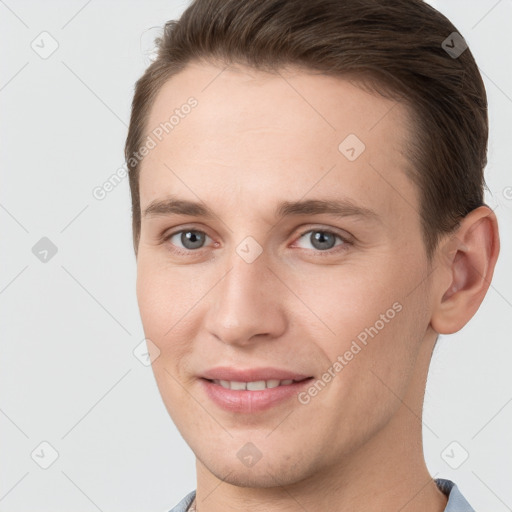 Joyful white young-adult female with short  brown hair and grey eyes