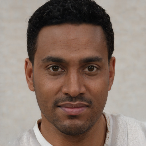 Neutral latino young-adult male with short  brown hair and brown eyes