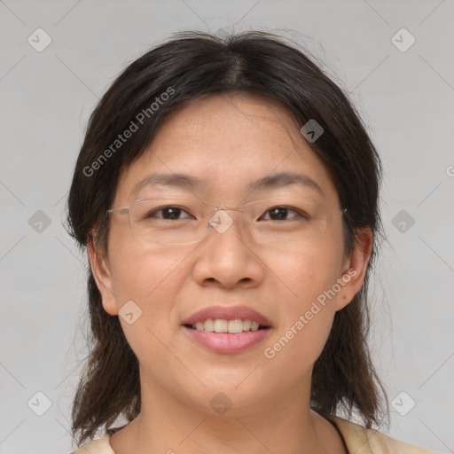 Joyful asian adult female with medium  brown hair and brown eyes