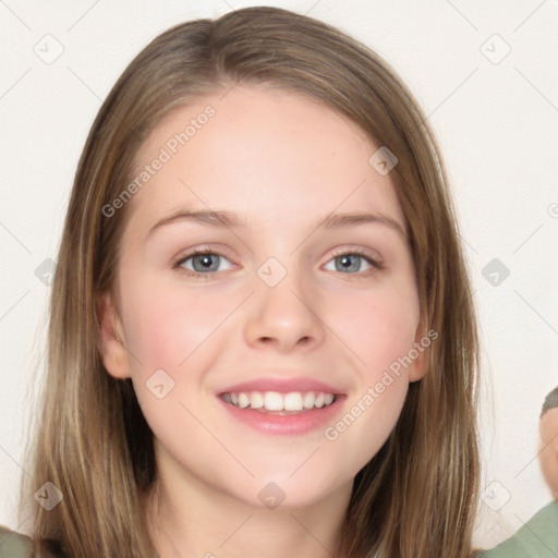 Joyful white young-adult female with long  brown hair and blue eyes