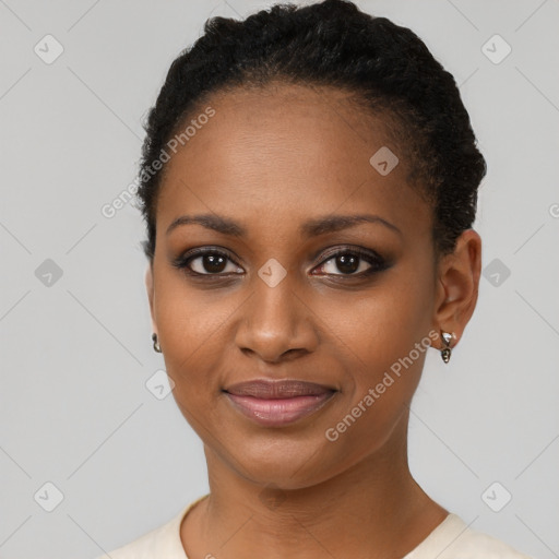 Joyful black young-adult female with short  black hair and brown eyes