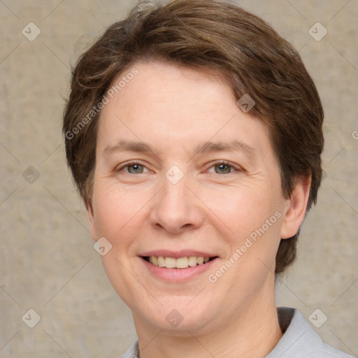 Joyful white adult female with short  brown hair and grey eyes