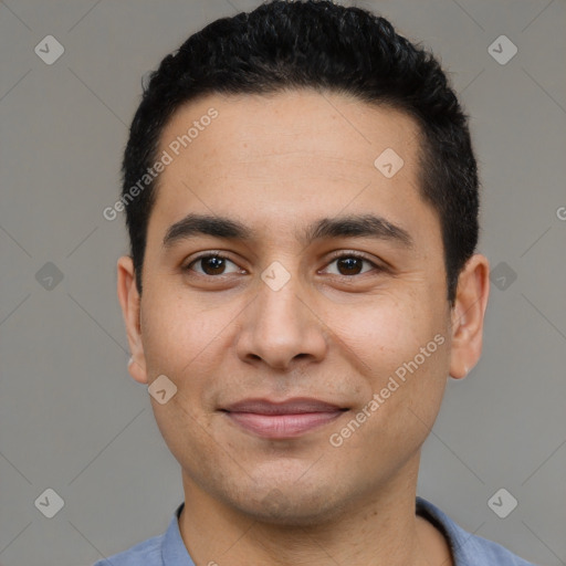 Joyful latino young-adult male with short  black hair and brown eyes