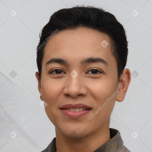 Joyful latino young-adult male with short  black hair and brown eyes