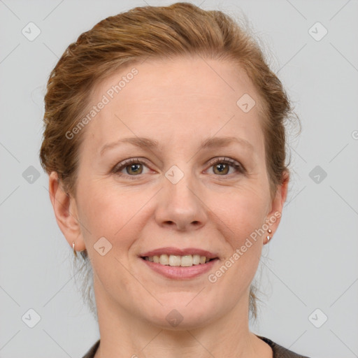 Joyful white adult female with short  brown hair and grey eyes