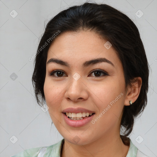 Joyful asian young-adult female with medium  brown hair and brown eyes