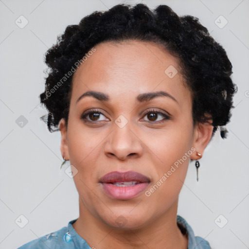 Joyful black adult female with short  black hair and brown eyes