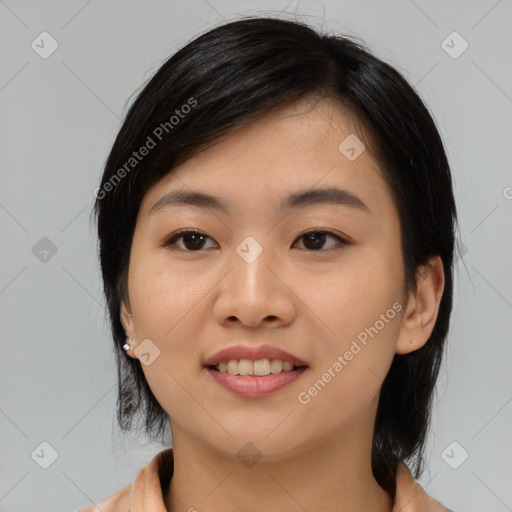 Joyful asian young-adult female with medium  black hair and brown eyes