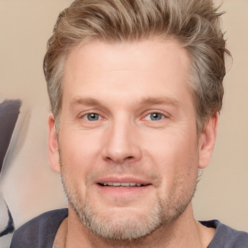 Joyful white adult male with short  brown hair and grey eyes