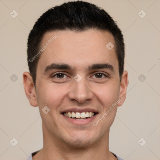 Joyful white young-adult male with short  black hair and brown eyes