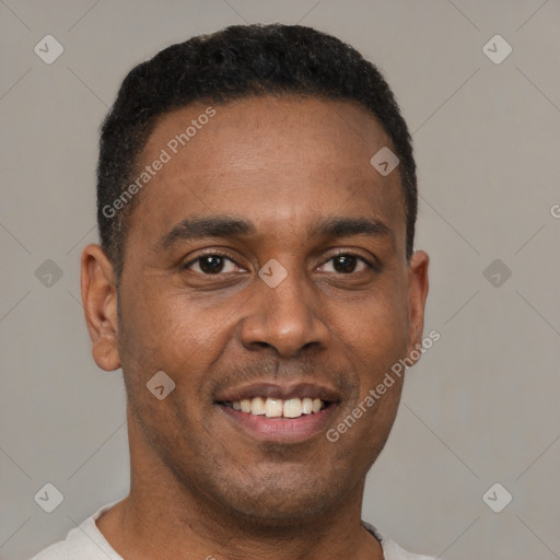 Joyful latino young-adult male with short  brown hair and brown eyes