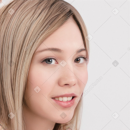 Joyful white young-adult female with long  brown hair and blue eyes