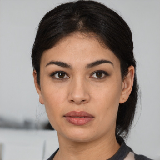 Neutral latino young-adult female with medium  black hair and brown eyes