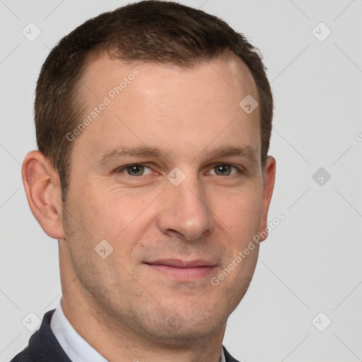 Joyful white adult male with short  brown hair and grey eyes