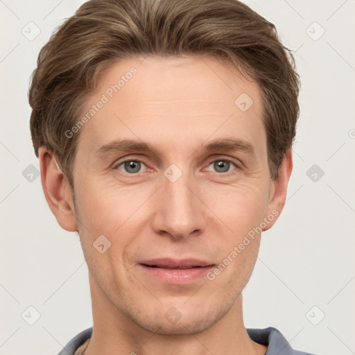 Joyful white adult male with short  brown hair and grey eyes