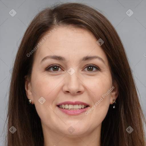 Joyful white adult female with long  brown hair and brown eyes