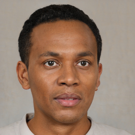 Neutral black young-adult male with short  black hair and brown eyes