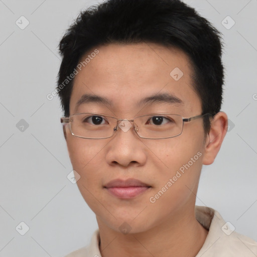 Joyful asian young-adult male with short  black hair and brown eyes