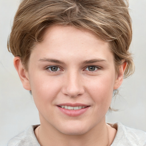 Joyful white young-adult female with medium  brown hair and blue eyes