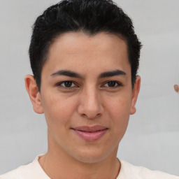 Joyful latino young-adult male with short  brown hair and brown eyes